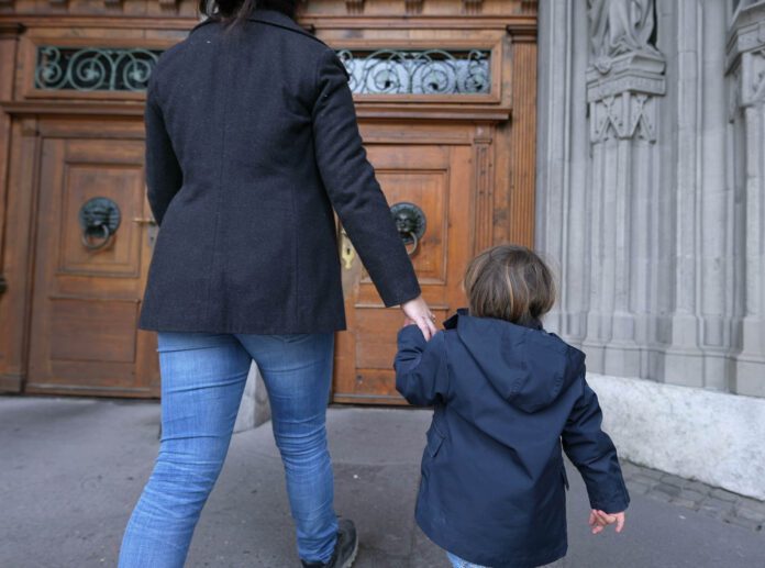 Mother,And,Child,Entering,Sacred,Temple,With,Hands,Held,Together,